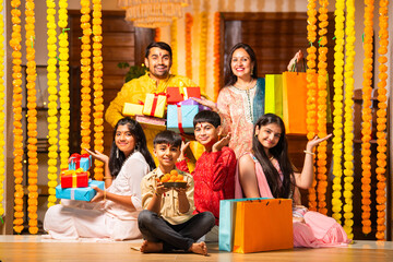 Indian family with kids celebrating rakhi or rakshabandhan festival or diwali