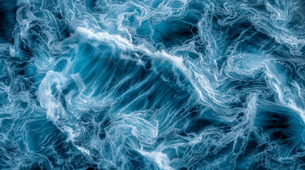 The image is of a large wave in the ocean, with the water appearing to be blue and white. The wave is crashing against the shore, creating a sense of power and movement. Scene is one of awe and wonder