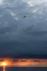 airplane in the sky at sunset
