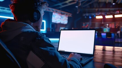 Obraz premium Strategic Mastermind Esports Pro Analyzing Tactics on Blank Screen Laptop in Gaming Lounge