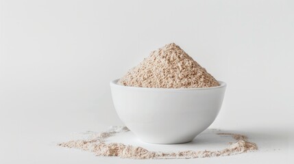 A photo of a single psyllium husk fiber gracefully arching out of a mound of psyllium husk powder in a white bowl,
