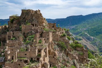 Ruins of the abandoned mountain village of Gamsutl on a May day. Dagestan, Russia