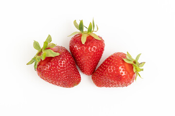 Three ripe strawberries isolated on a white background