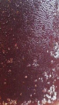 Soft drink in the glass with bubbles. Sweet wine is ready to serve in the club bar. Eye soothing intro clip for cold drink advertising and branding. Opening for tv commercial and billboard advertising
