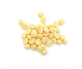 Organic cocoa butter buttons (wafers) isolated on white background