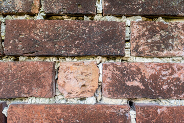 Obraz premium Old weathered brick wall in need of repointing .