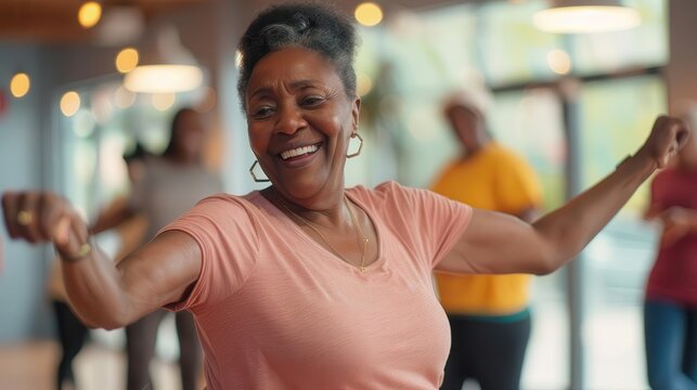 joyful senior african american woman dancing energetically during dance class lifestyle portrait