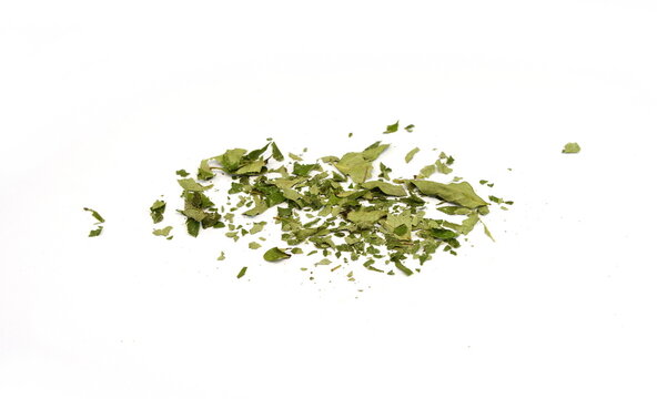 Dried curry leaves isolated on white background. Karivepaku or karuveppilai podi. Karapincha chips. curry leaves chips, coarse cuts. 