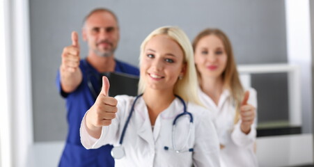 Group of doctor show ok or confirm sign with thumb up portrait. High level therapy great heal participation healthy lifestyle satisfied patient therapeutist arm best consultation physical
