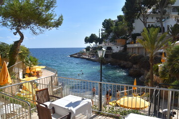 Luxury hotel by the turquoise and azure blue waters of Mallorca in the Spanish Mediterranean Sea