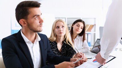 Beautiful smiling woman portrait with group of people listen carefully during seminar. Study event...