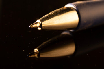 Photograph of a gold pen with visible details Traces of use for a long time