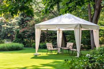 White gazebo with plastic furniture on green lawn vertical copy space