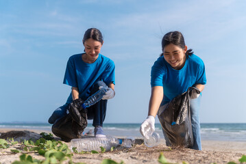 Plastic pollution and environmental problem concept. Happy asian diverse group of volunteers with...