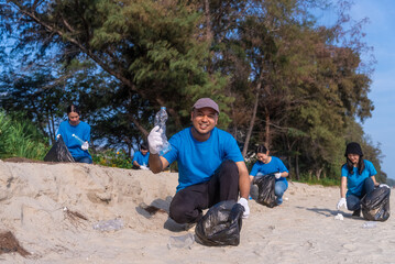 Plastic pollution and environmental problem concept. Happy asian diverse group of volunteers with...