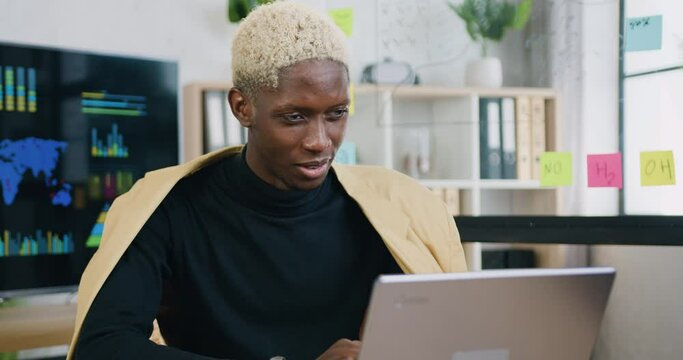 Business man sit at workplace at laptop during talking to customer using remote web chat, online video conference application