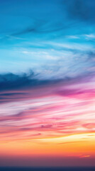 Obraz premium A beautiful blue sky with a pink and orange sunset