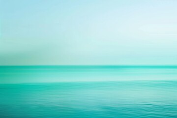 Obraz premium Minimalist seascape featuring calm ocean water merging with the pastel colors of the sky, creating a serene and tranquil atmosphere