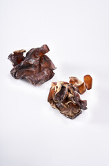 Close up of wild dried black fungus on white background