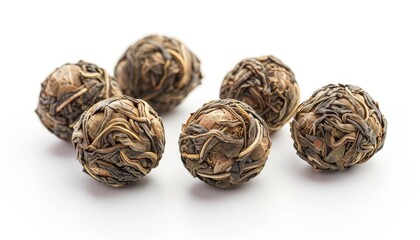 Fototapeta premium Jasmine tea balls on a white background also known as flowering or blooming tea Close up shot
