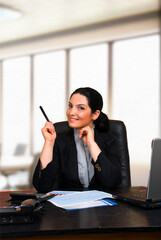 Young Woman Doing Business in Office
