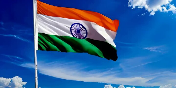 Indian flag flying high in the sky against a clear blue backdrop, symbolizing national pride and freedom and celebrating Independence Day and Republic Day