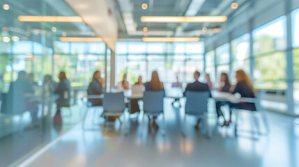Blur of People in Modern Office Environment with Bright Sunlight