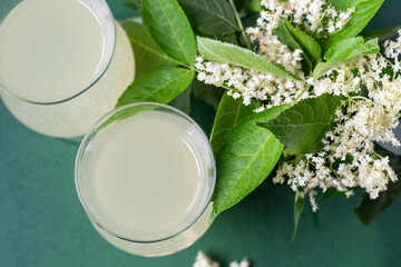 Carbonated elderflower drink. Flower summer kvass in glasses. Sparkling homemade hugo water. Buza drinks