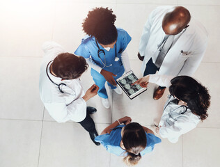 Top view, doctors and teamwork with tablet screen, x ray and cooperation with healthcare, help and advice. Group, meeting and medical with brain surgery, tech and people with diagnosis and results