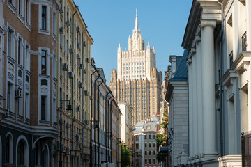 Obraz premium Buildings in Krivoarbatsky Lane and the high-rise of the Ministry of Foreign Affairs, Arbat district in Moscow