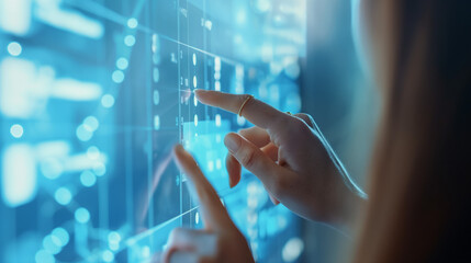 a woman's fingers point and press buttons on a virtual screen filled with numbers, text, and symbols to regulate machine operations in a machine control center