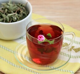Cup of herbal infusion from Cistus incanus, known as rock rose. Traditional curative herbal tea...