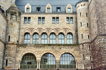 stone walls and windows of the historic Imperial Castle in the city of Poznan