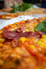 slice of pizza with bacon