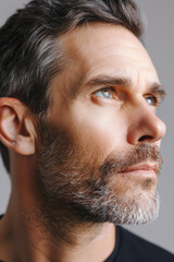 Obraz premium A portrait of an American man highlighting his facial skin care routine, close-up view