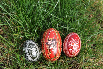 Traditional hand-dyed colourful Easter eggs in Poland called pisanka or kroszonka in green grass