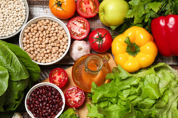 Different vegetarian products on wooden table, top view
