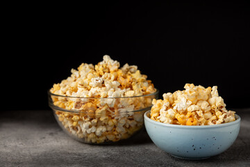 Tasty popcorn on wooden background. Cinema and entertainment concept. Movie night with...