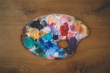 Artist's palette on wooden background