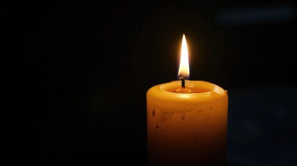 Illuminating candle flame against a mysterious dark background, casting a warm glow and creating an ambiance of serenity