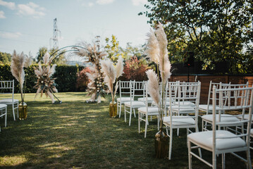 Flower decoration. Decoration of tables and chairs. Pastel colors, natural flowers.