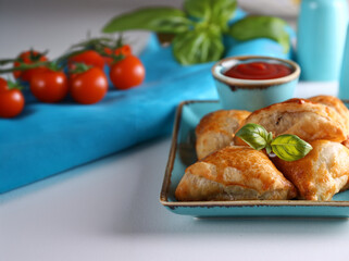 mini samsa snack pies with sauce