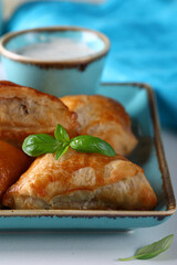mini samsa snack pies with sauce
