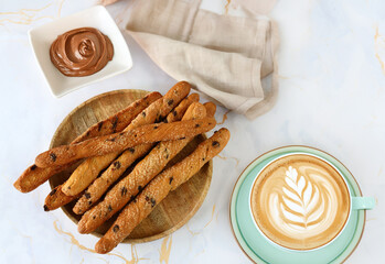 sweet grissini breadsticks for dessert on the table