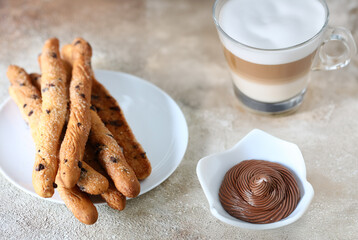 sweet grissini breadsticks for dessert on the table