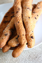 sweet grissini breadsticks for dessert on the table