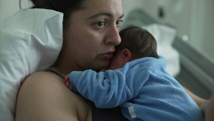 New mother in hospital bed holding newborn baby on chest, showcasing bonding and emotional connection, healthcare setting, postnatal care, nurturing love, and modern motherhood