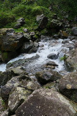 River with Abundant Rocks Near the Waterfall