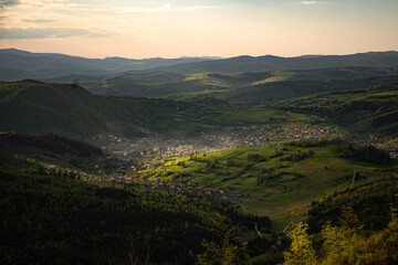 Fototapeta premium countryside area with rolling hills in carpathian mountains at sunrise. Borzhava range. Carpathian mountains, Ukraine