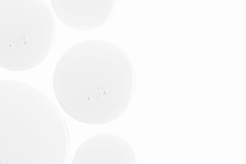 Drops of transparent gel on a light background. Empty space